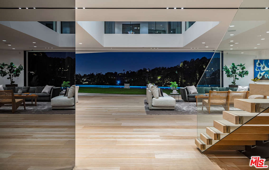 1259 Beverly Estate Drive Beverly Hills, CA 90210 - Photo 32 of 43 a view of living room with patio furniture and a potted plant