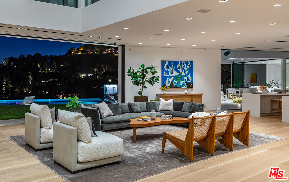 1259 Beverly Estate Drive Beverly Hills, CA 90210 - Photo 33 of 43 a living room with furniture and a floor to ceiling window