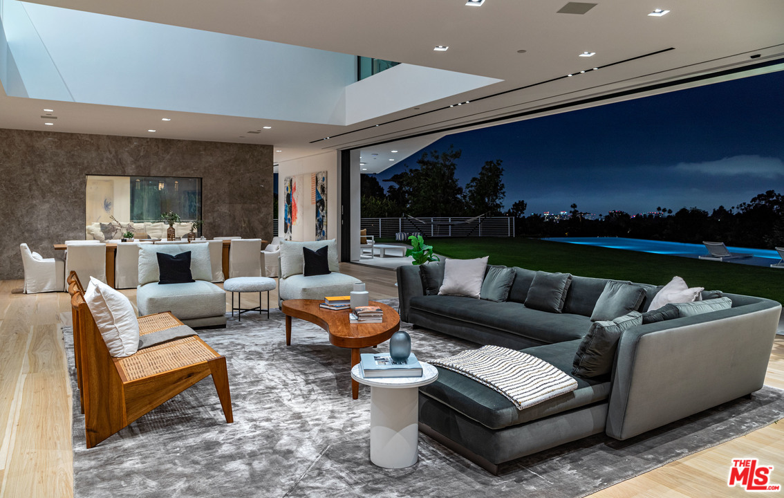 1259 Beverly Estate Drive Beverly Hills, CA 90210 - Photo 34 of 43 a living room with furniture and a view of kitchen