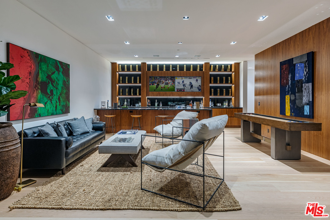 1259 Beverly Estate Drive Beverly Hills, CA 90210 - Photo 36 of 43 a living room with furniture and a flat screen tv