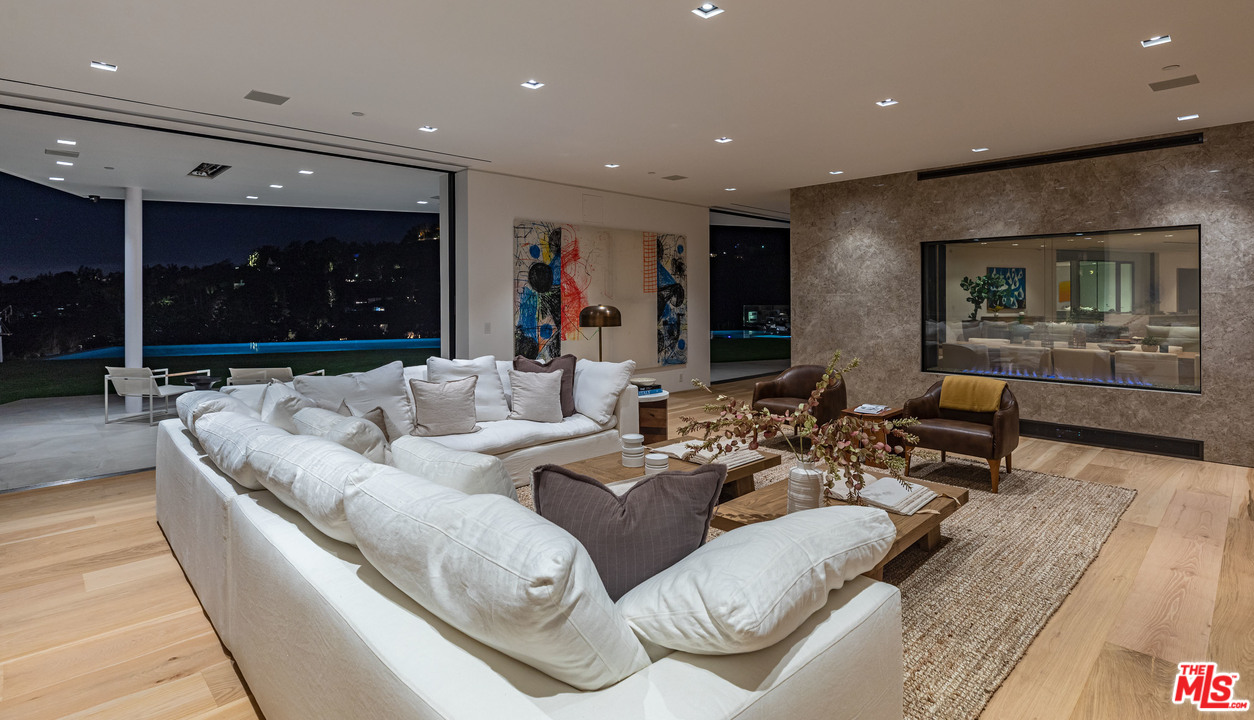 1259 Beverly Estate Drive Beverly Hills, CA 90210 - Photo 40 of 43 a living room with furniture and a large window