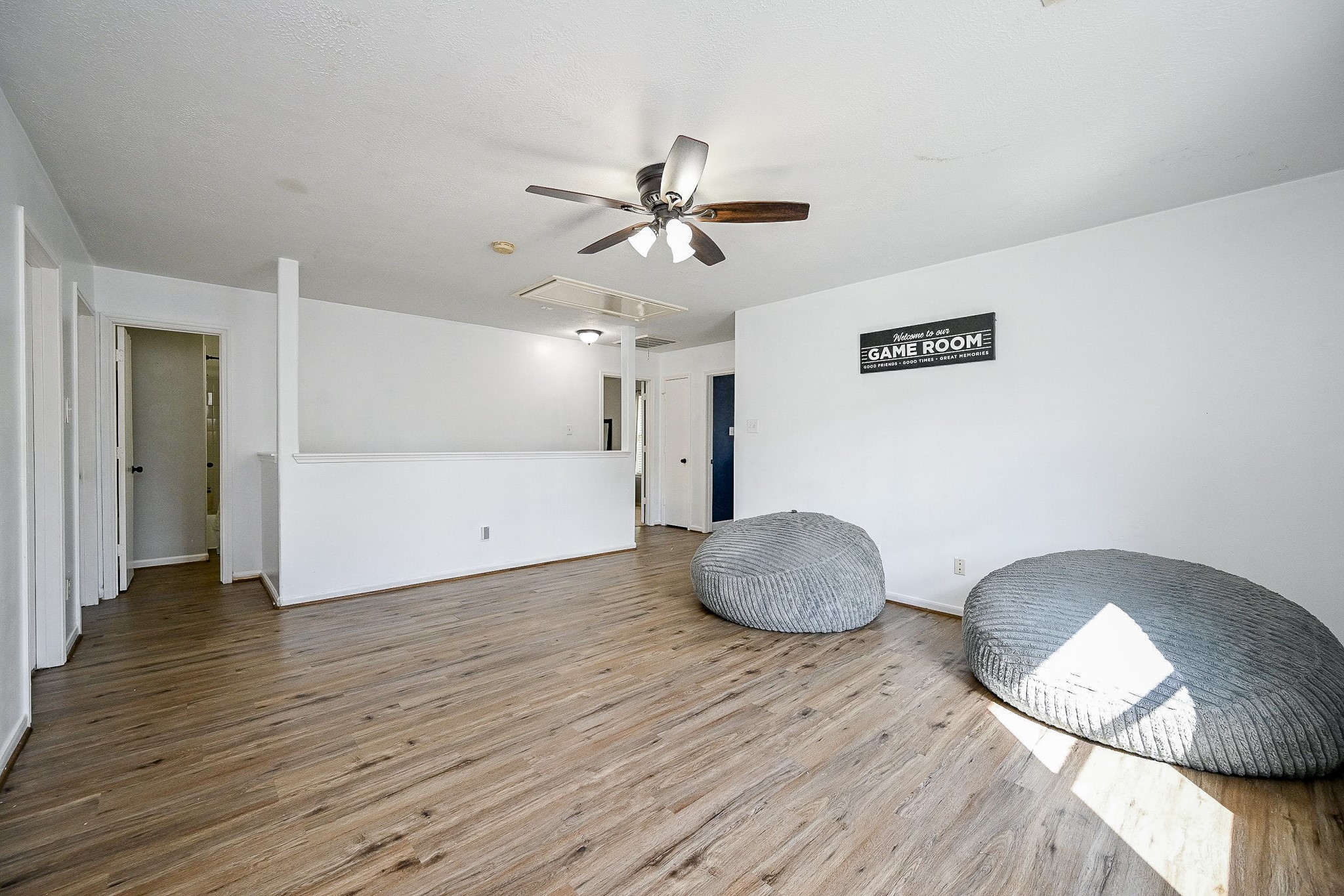 2534 Halstead Drive Spring, TX 77386 - Photo 21 of 35 This bright and spacious game room featuring laminate wood flooring, a ceiling fan, and plenty of natural light is the perfect spot for some family fun!