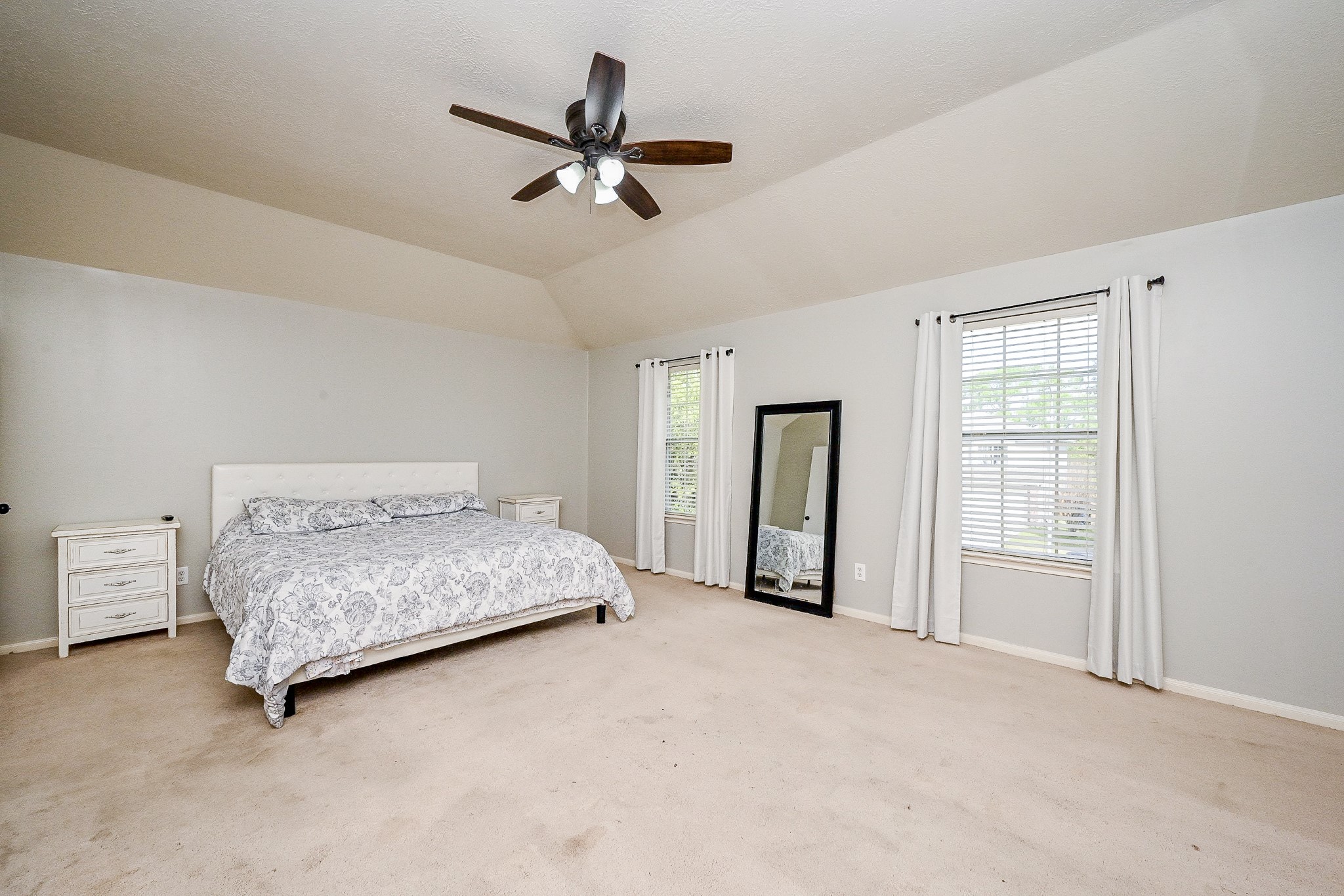 2534 Halstead Drive Spring, TX 77386 - Photo 25 of 35 Such a spacious primary bedroom with high ceilings and lots of natural light.