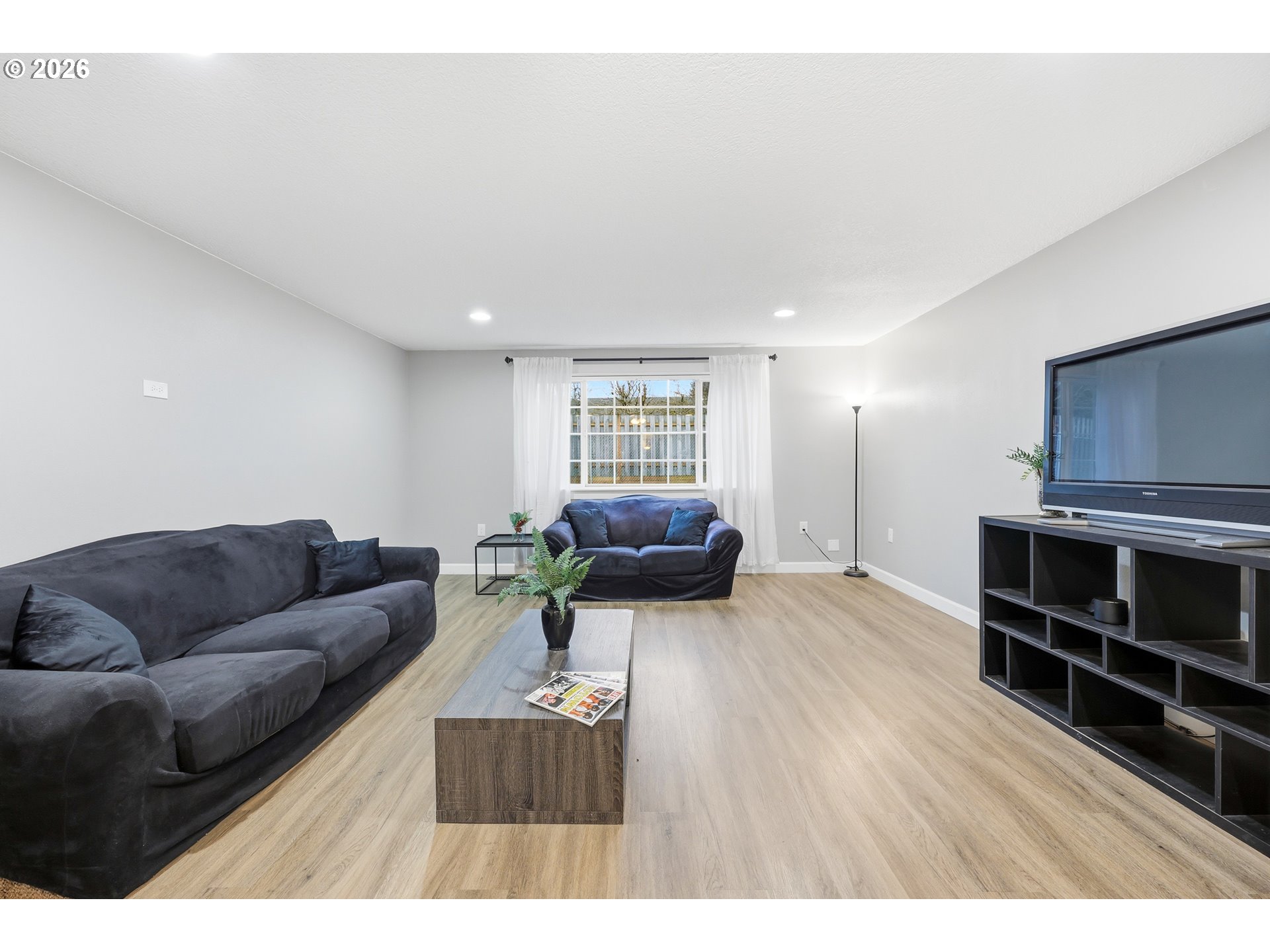 2073 Southeast Kane Avenue Gresham, OR 97080 - Photo 12 of 25 a living room with furniture and a flat screen tv