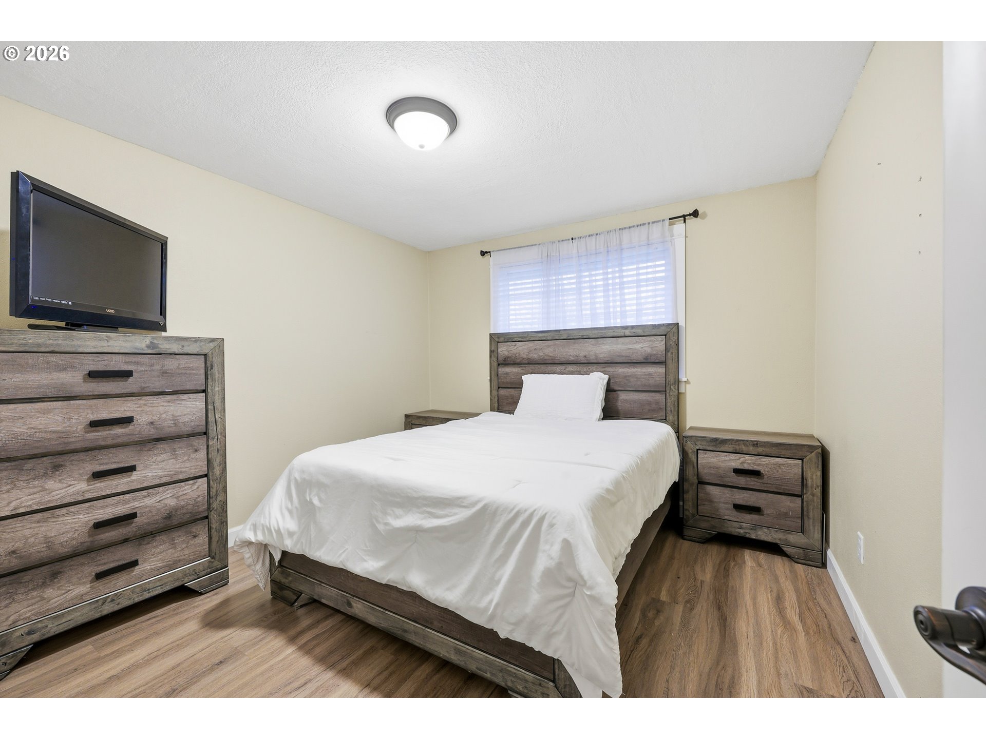 2073 Southeast Kane Avenue Gresham, OR 97080 - Photo 19 of 25 a bedroom with a bed and a flat screen tv
