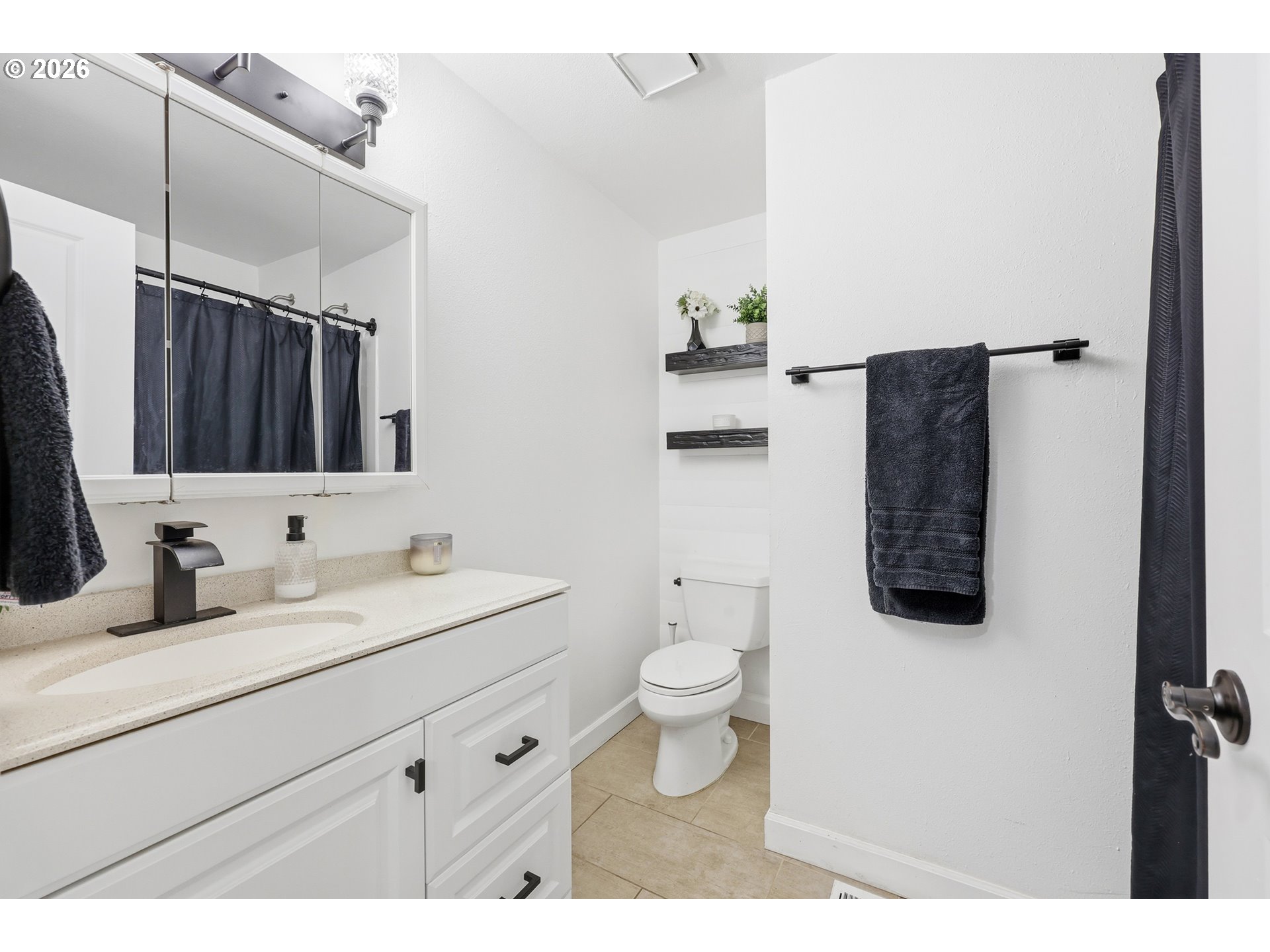 2073 Southeast Kane Avenue Gresham, OR 97080 - Photo 21 of 25 a bathroom with a toilet sink and mirror