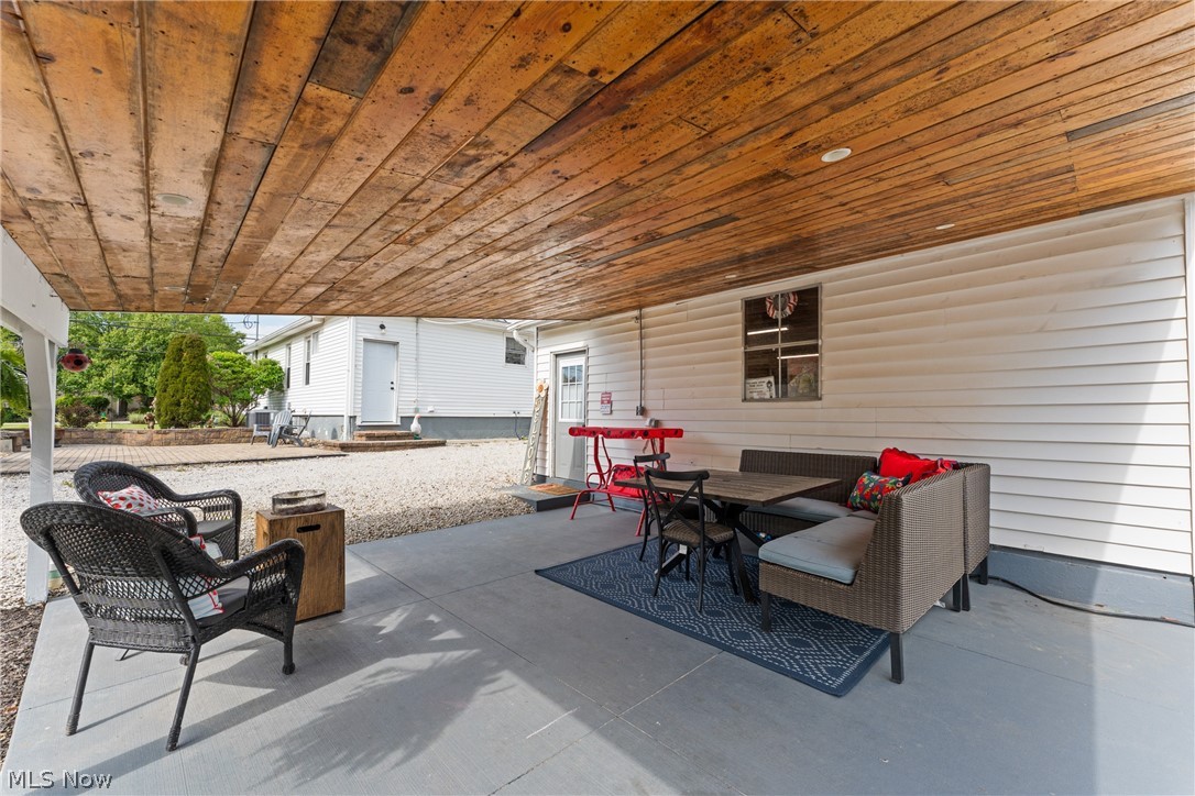 258 Randolph Road Mogadore, OH 44260 - Photo 5 of 49 Covered patio featuring a wood-panel ceiling with recessed lighting