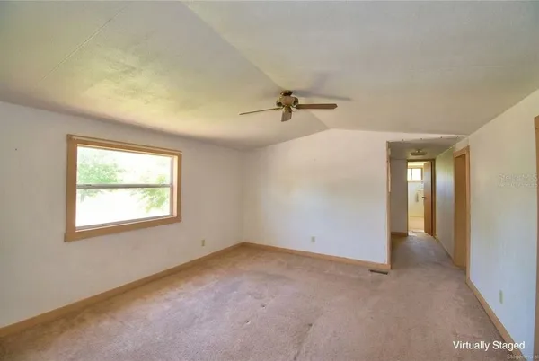 a bed room with a bed and a chair