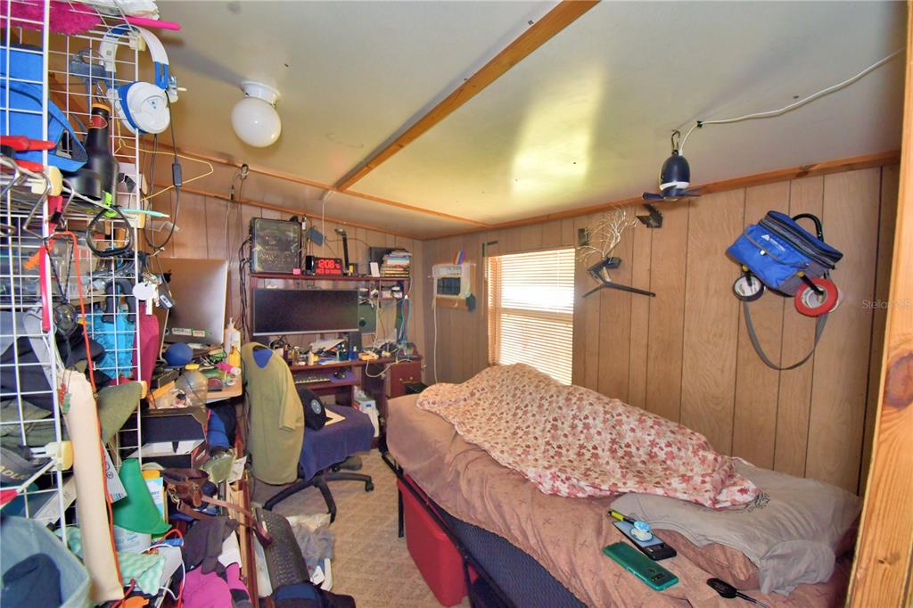 2039 Ranchland Drive Lakeland, FL 33809 - Photo 22 of 93 a bed room with a bed and a couch