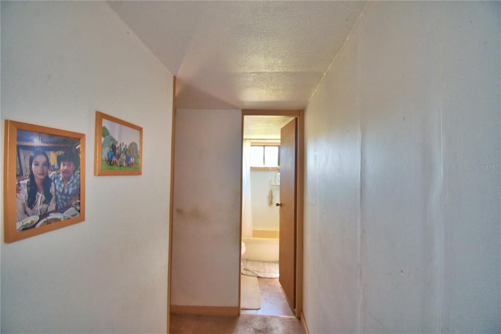 2039 Ranchland Drive Lakeland, FL 33809 - Photo 25 of 93 a view of a hallway with wooden floor