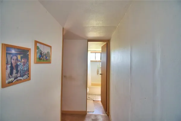 a view of backyard of house with green space