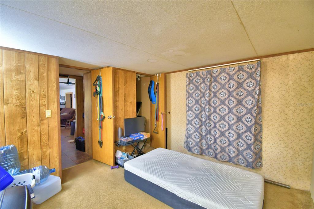 2039 Ranchland Drive Lakeland, FL 33809 - Photo 35 of 93 a bedroom with a bed and a window