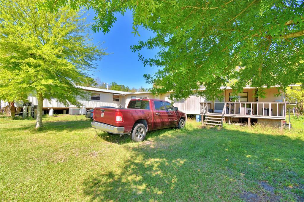 2039 Ranchland Drive Lakeland, FL 33809 - Photo 51 of 93 a view of backyard with swimming pool and seating area
