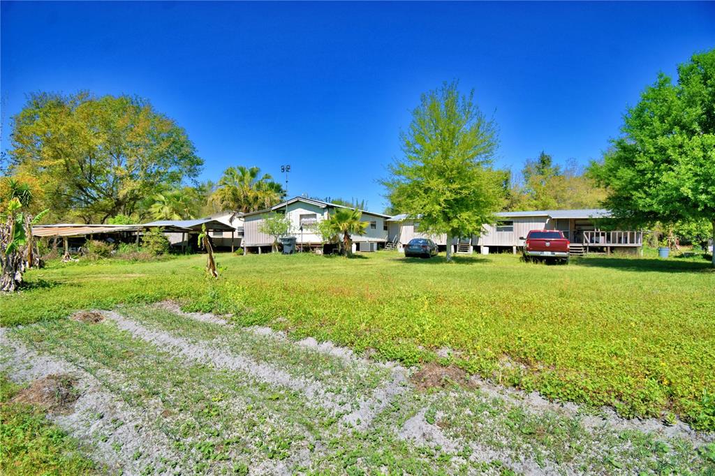 2039 Ranchland Drive Lakeland, FL 33809 - Photo 86 of 93 a green field with trees in the background