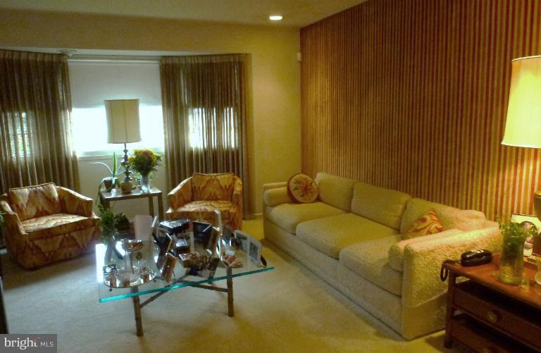 3003 Northbrook Road Baltimore, MD 21208 - Photo 2 of 19 a living room with furniture and a chandelier