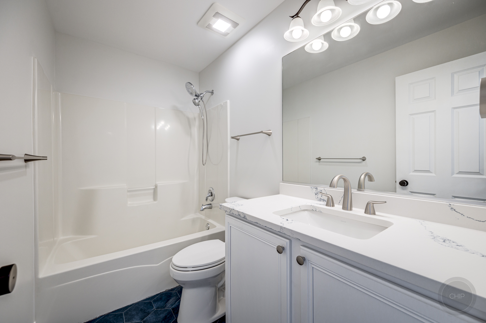 12948 Parterre Place Plainfield, IL 60585 - Photo 32 of 35 a bathroom with a sink a toilet a tub and shower