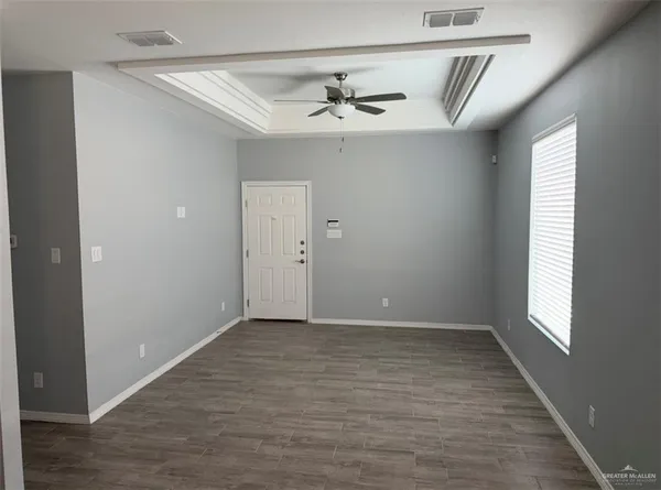 a view of an empty room with a window