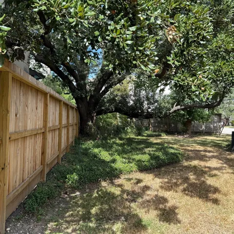 a view of backyard with green space