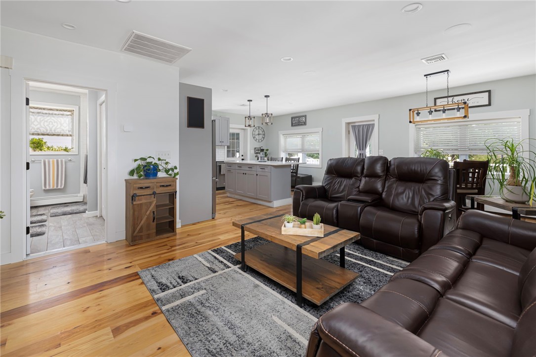 145 Jenckes Hill Road Lincoln, RI 02865 - Photo 15 of 39 The living room area is able to accommodate multiple pieces of larger furniture.
