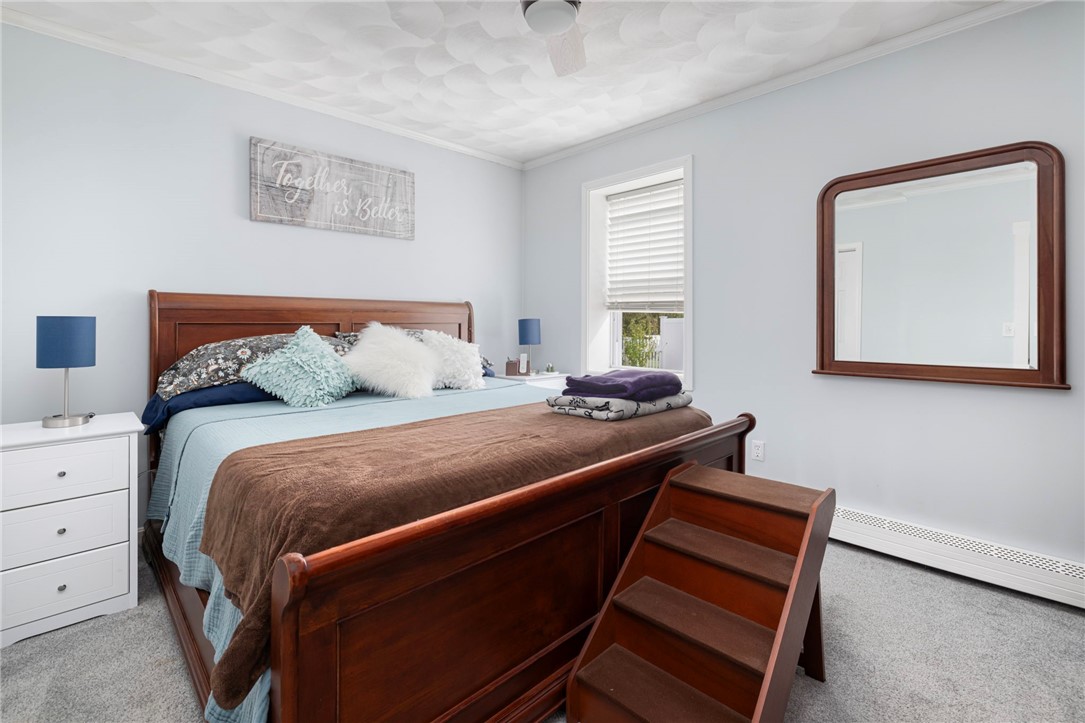 145 Jenckes Hill Road Lincoln, RI 02865 - Photo 21 of 39 The spacious, second bedroom offers views to the yard.