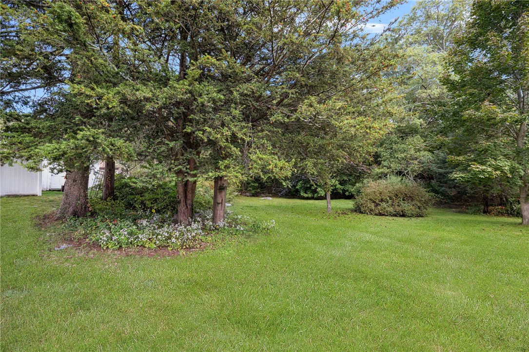 145 Jenckes Hill Road Lincoln, RI 02865 - Photo 34 of 39 The yard continues beyond the fenced portion. This lovely yard has a variety of decorative trees, perrenials and mature landscaping.