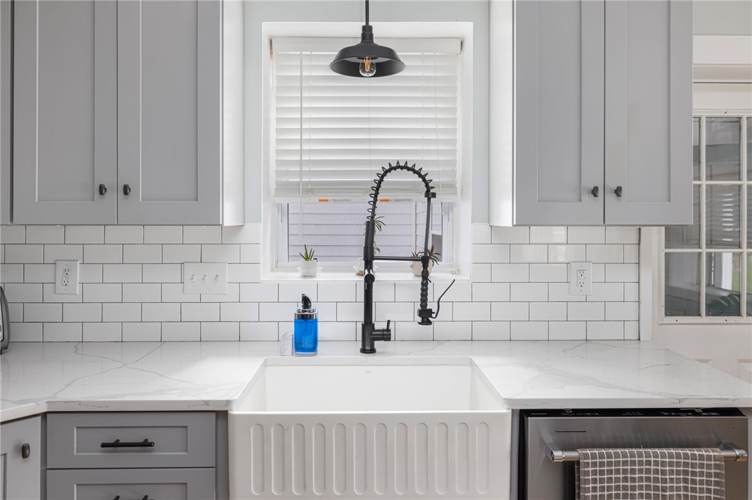 145 Jenckes Hill Road Lincoln, RI 02865 - Photo 10 of 39 Updated and stylish with quartz countertops and a tile backsplash.