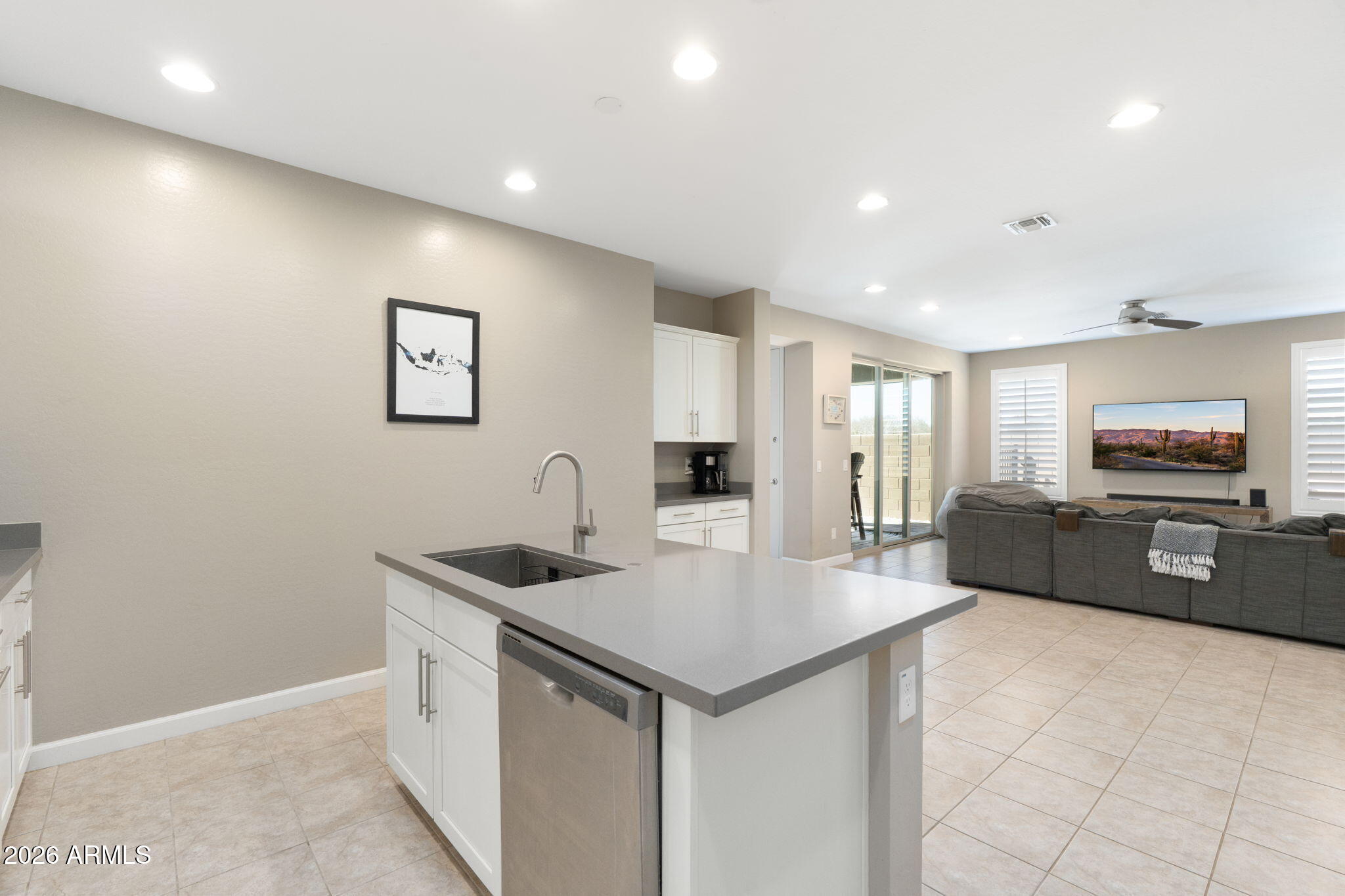 4041 East Amber Lane Gilbert, AZ 85296 - Photo 12 of 31 a kitchen with stainless steel appliances granite countertop a sink and a refrigerator