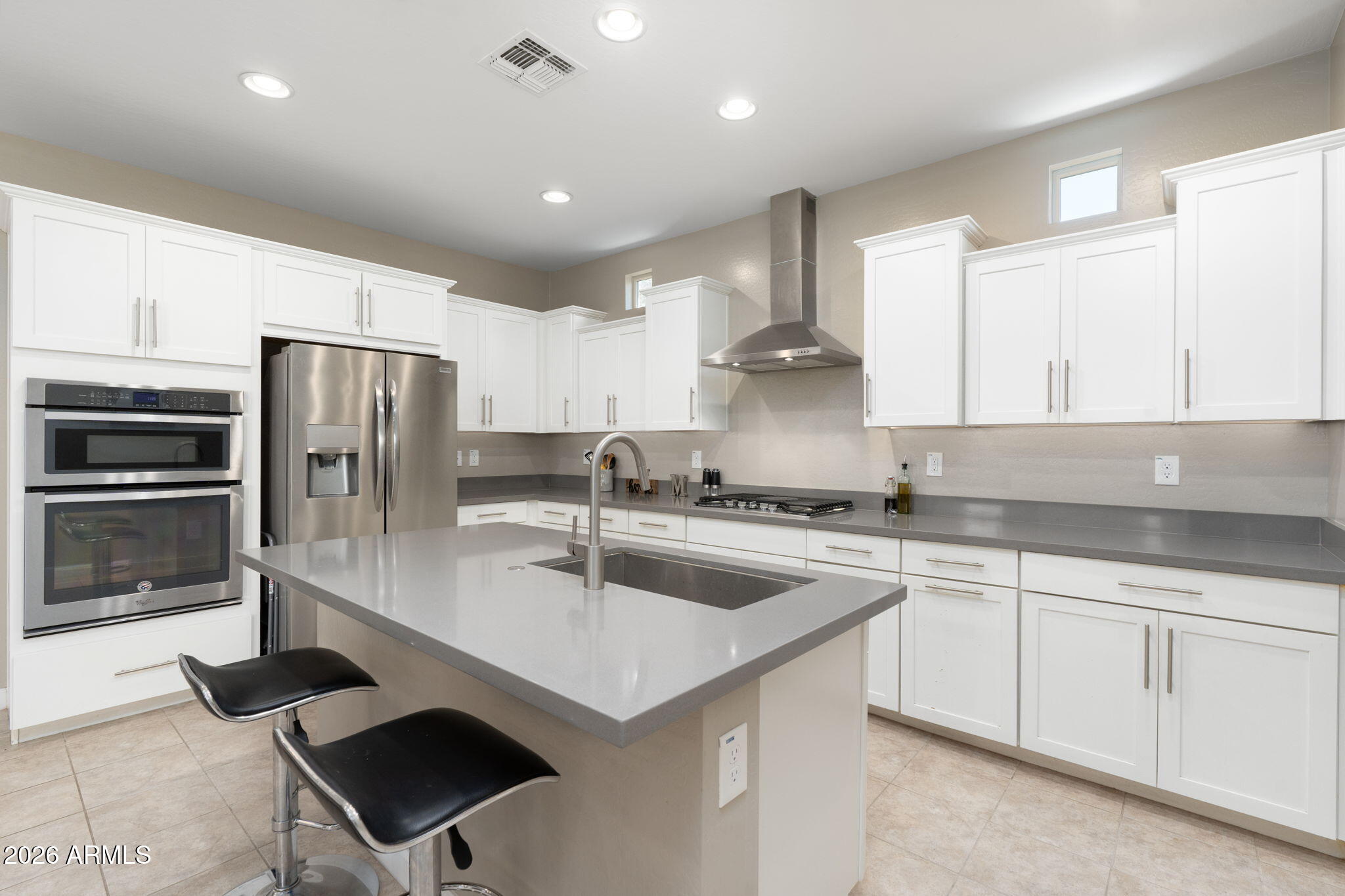 4041 East Amber Lane Gilbert, AZ 85296 - Photo 13 of 31 a kitchen with a sink stainless steel appliances and cabinets