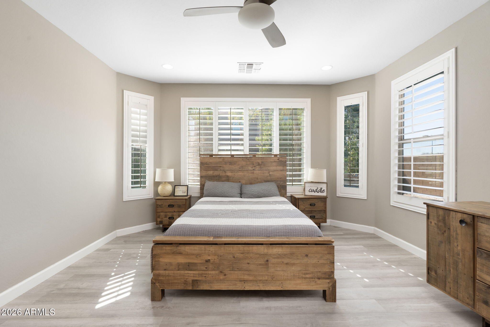 4041 East Amber Lane Gilbert, AZ 85296 - Photo 15 of 31 a spacious bedroom with a large bed and a large window