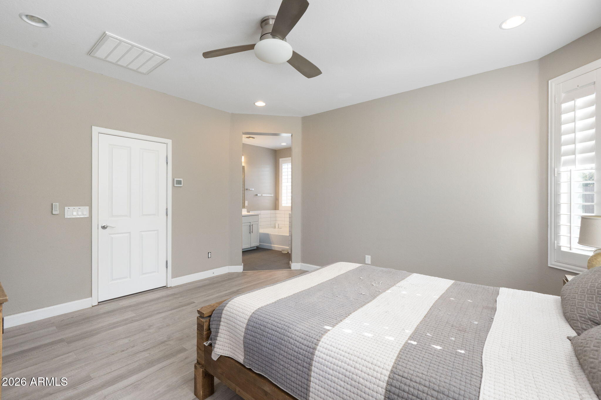 4041 East Amber Lane Gilbert, AZ 85296 - Photo 17 of 31 a bedroom with a bed and a window