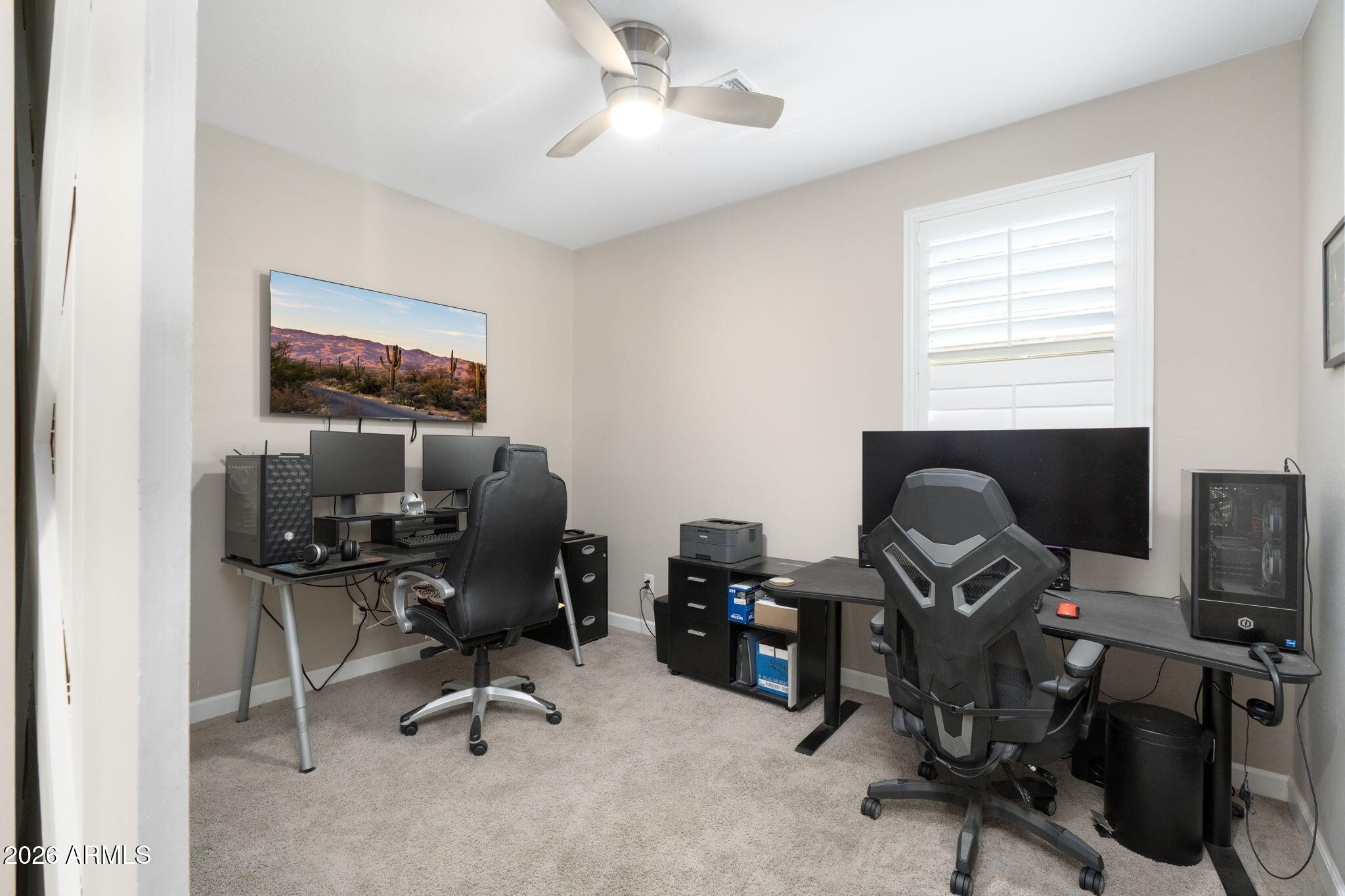 4041 East Amber Lane Gilbert, AZ 85296 - Photo 20 of 31 a view of a workspace with furniture and a window