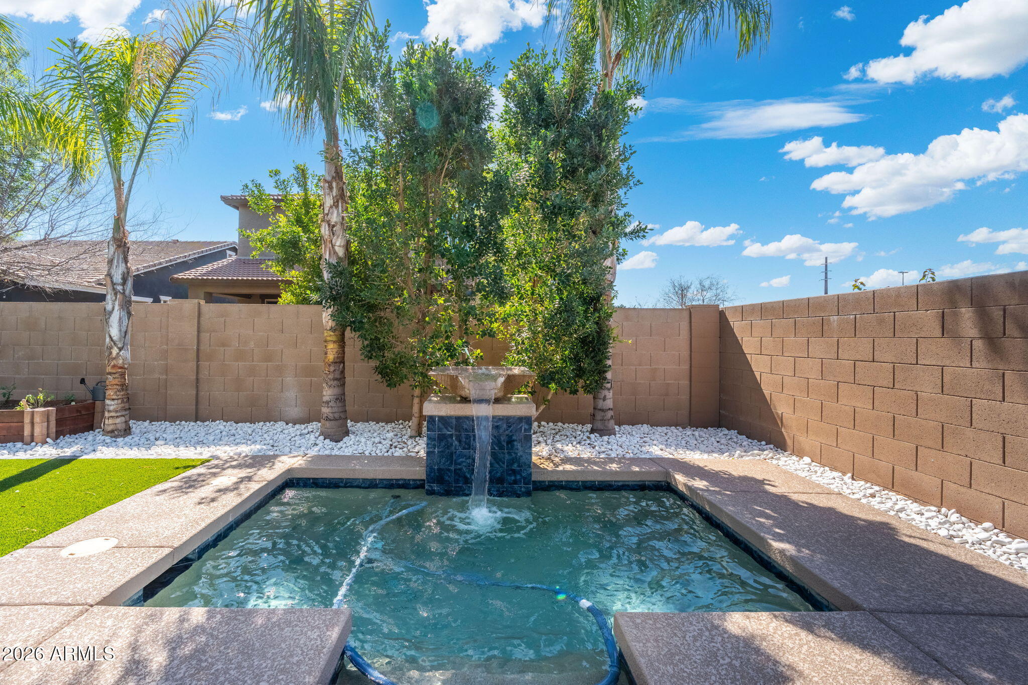 4041 East Amber Lane Gilbert, AZ 85296 - Photo 23 of 31 a backyard of a house with table and chairs