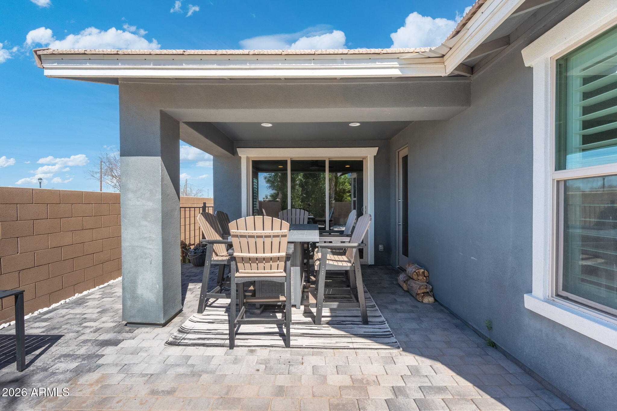 4041 East Amber Lane Gilbert, AZ 85296 - Photo 26 of 31 a view of a patio with a dining table and chairs