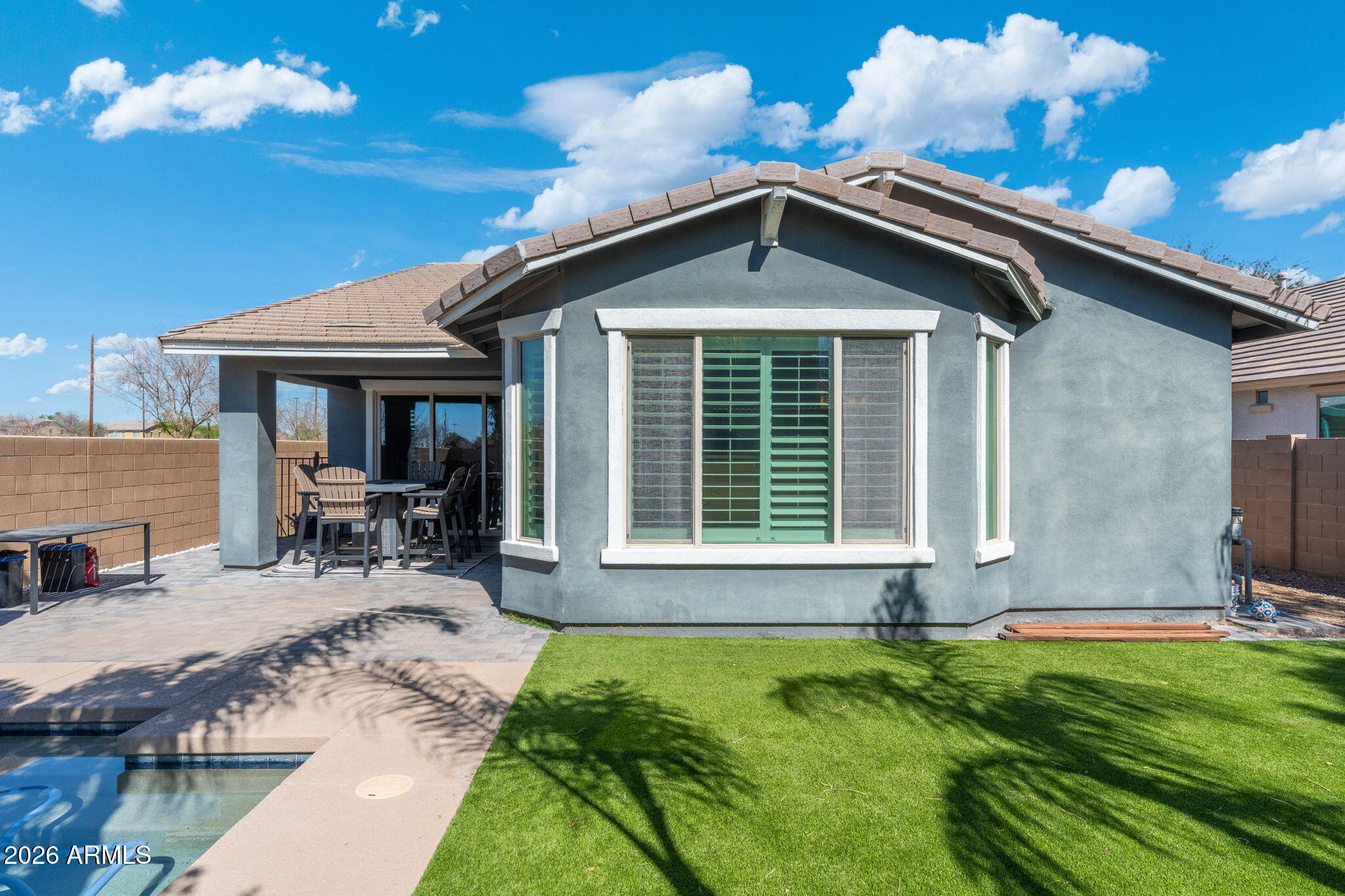 4041 East Amber Lane Gilbert, AZ 85296 - Photo 29 of 31 a front view of a house with swimming pool and porch