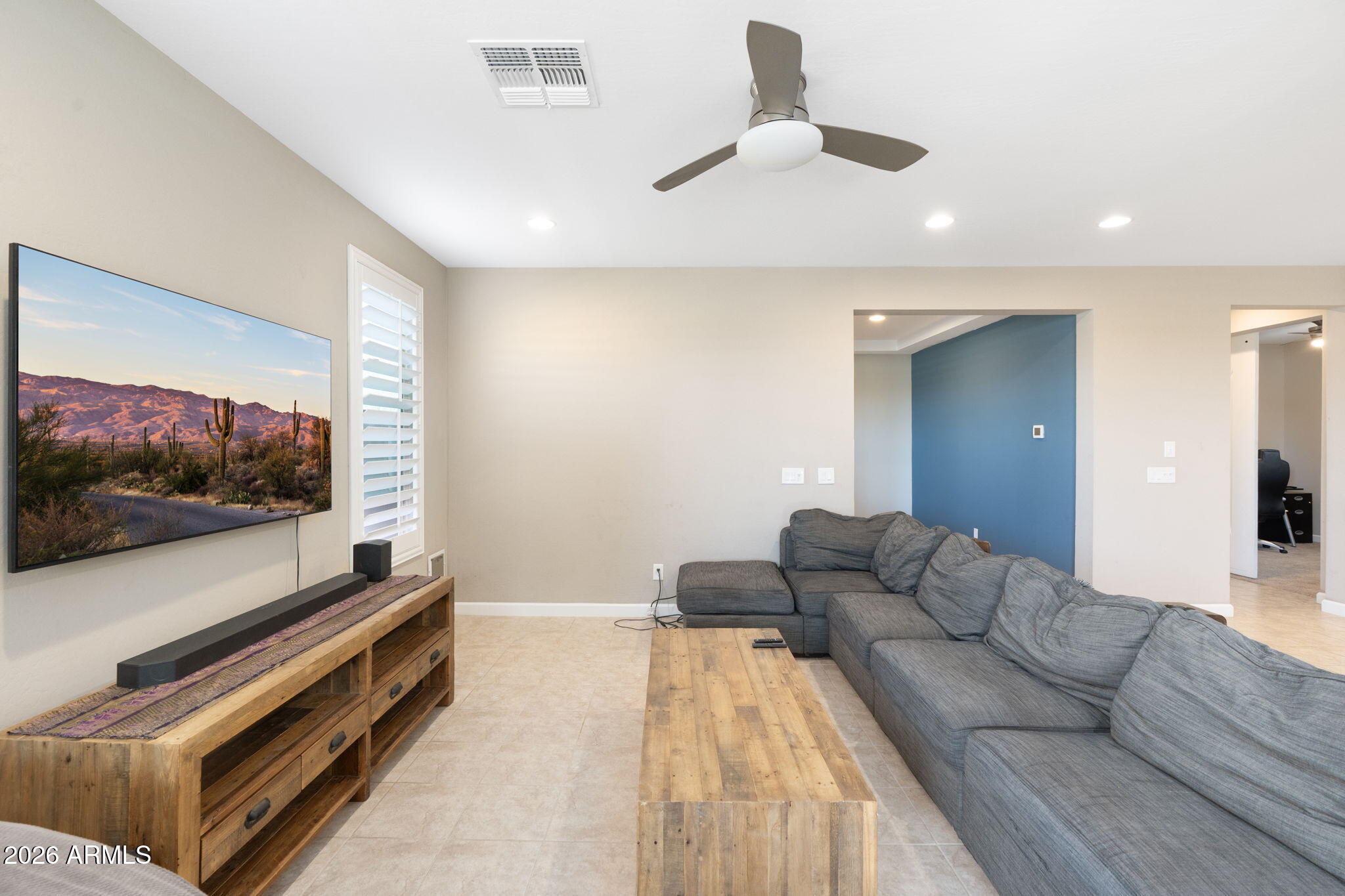 4041 East Amber Lane Gilbert, AZ 85296 - Photo 8 of 31 a living room with furniture and a flat screen tv