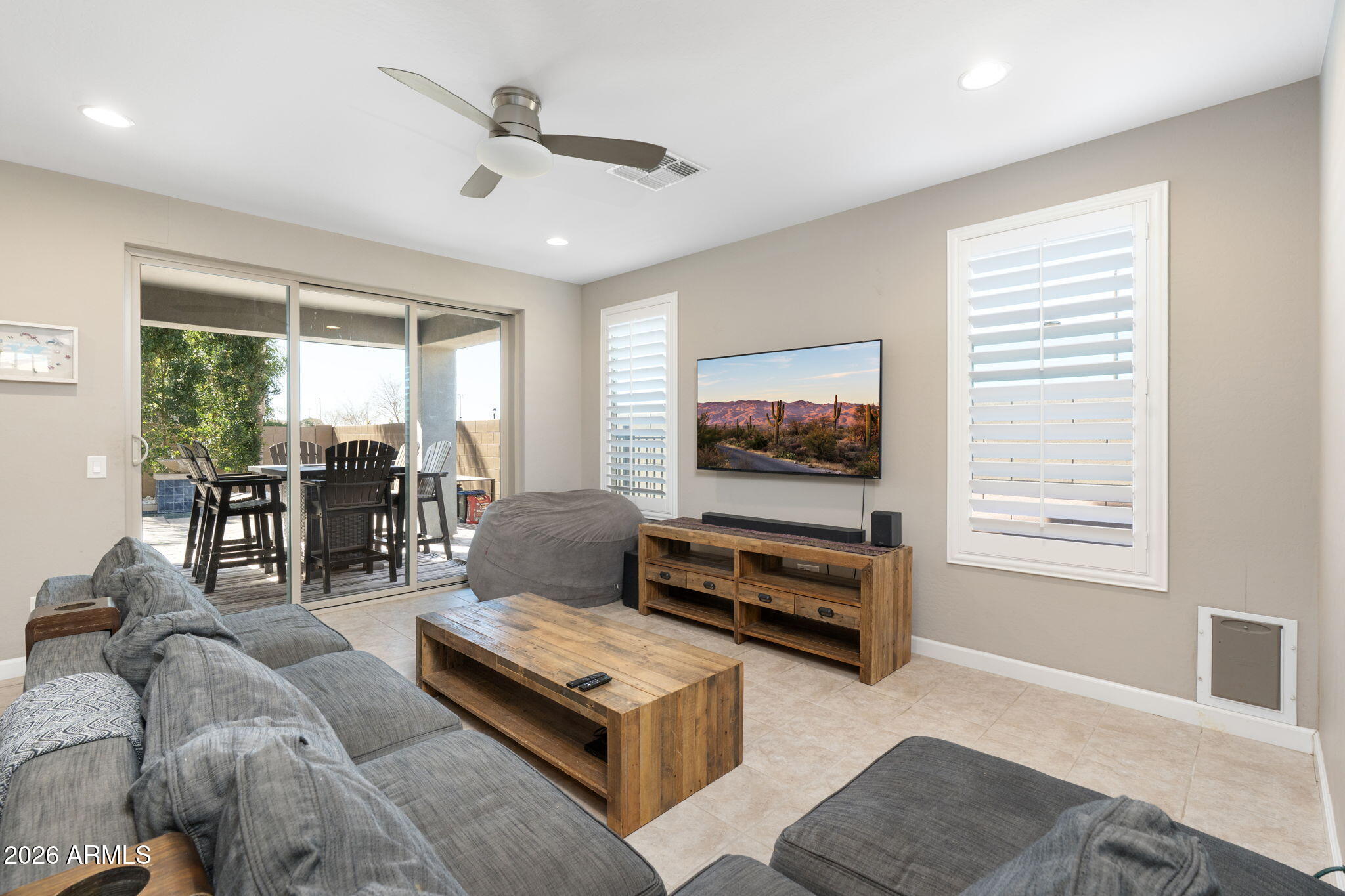 4041 East Amber Lane Gilbert, AZ 85296 - Photo 9 of 31 a living room with furniture and a flat screen tv