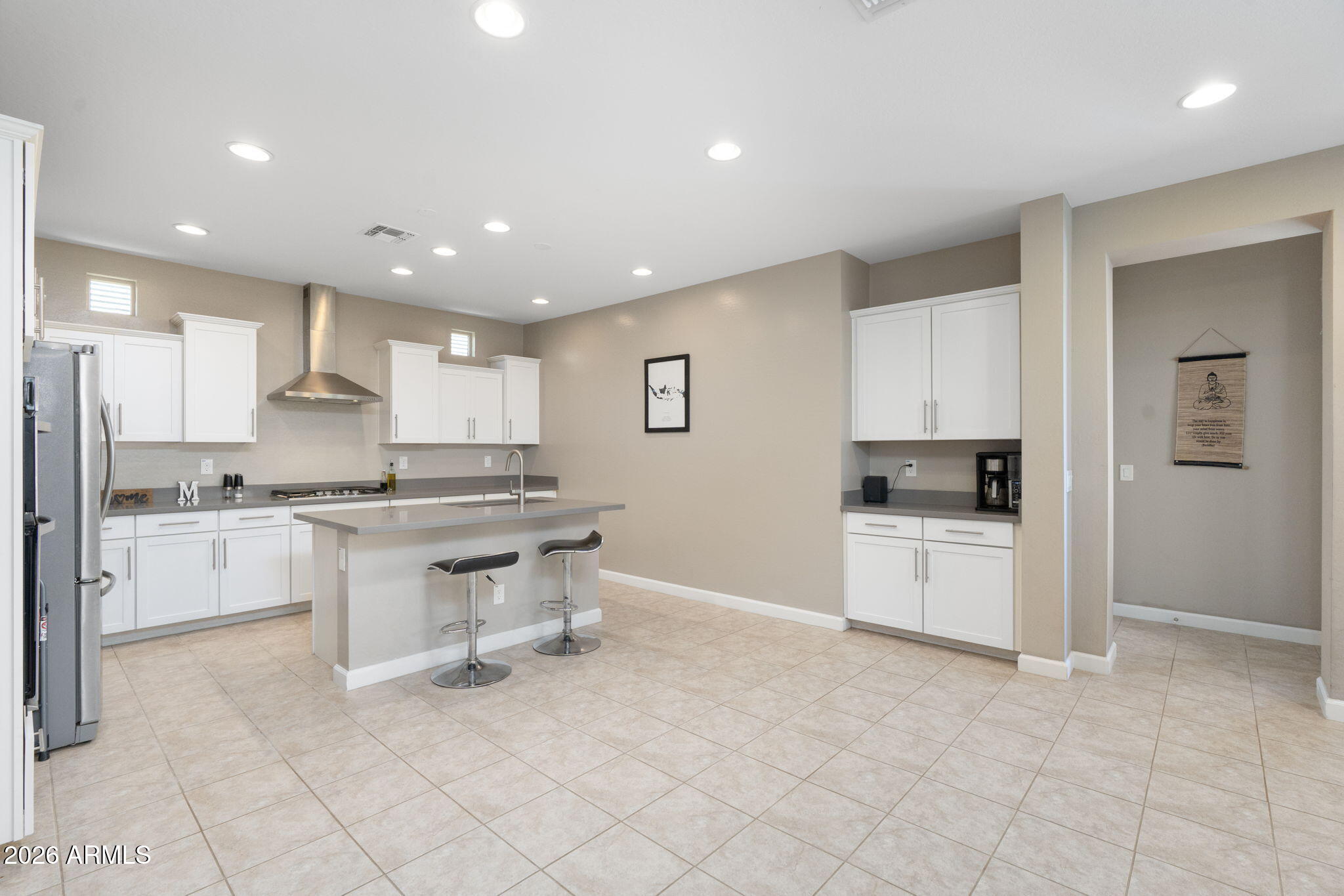 4041 East Amber Lane Gilbert, AZ 85296 - Photo 10 of 31 a kitchen with white cabinets and white appliances