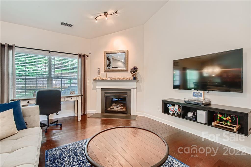 11619 Allen A Brown Road Charlotte, NC 28269 - Photo 15 of 30 a living room with furniture and a flat screen tv