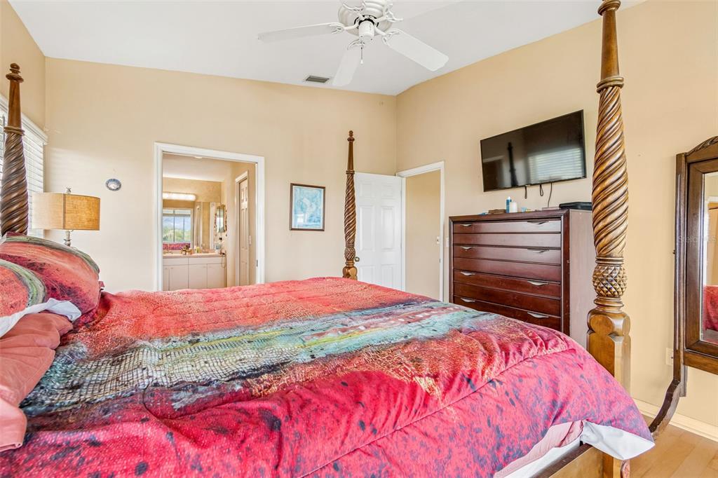 119 Burns Road Terra Ceia, FL 34250 - Photo 41 of 100 a bedroom with a bed and a flat screen tv