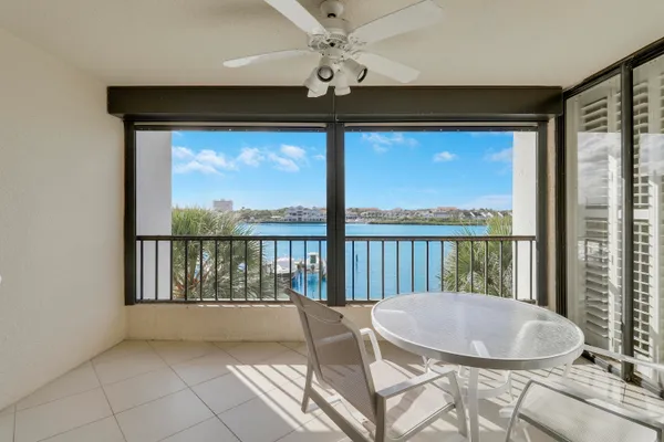 a view of balcony with a table and chairs