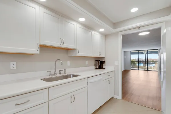 a kitchen with sink and cabinets