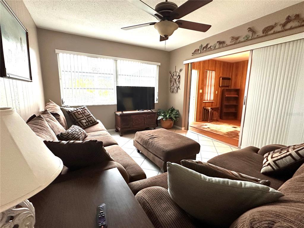 10400 112th Way Largo, FL 33778 - Photo 11 of 30 a living room with furniture and a window