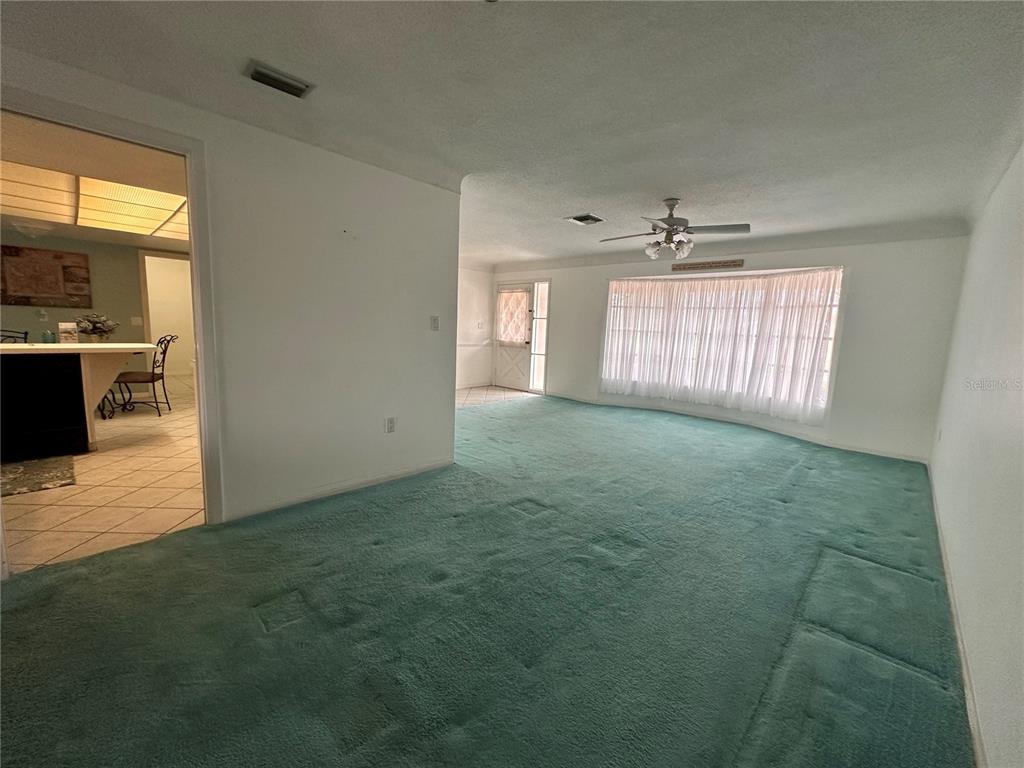 10400 112th Way Largo, FL 33778 - Photo 6 of 30 a view of an empty room with a window