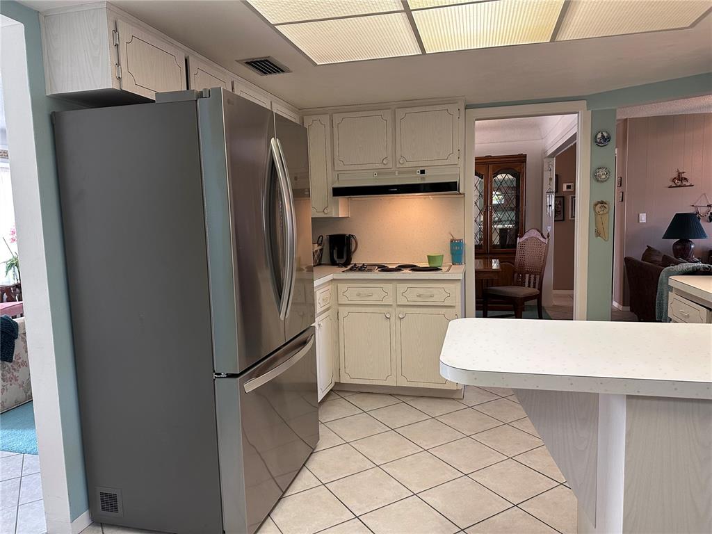 10400 112th Way Largo, FL 33778 - Photo 9 of 30 a kitchen with a refrigerator and a sink