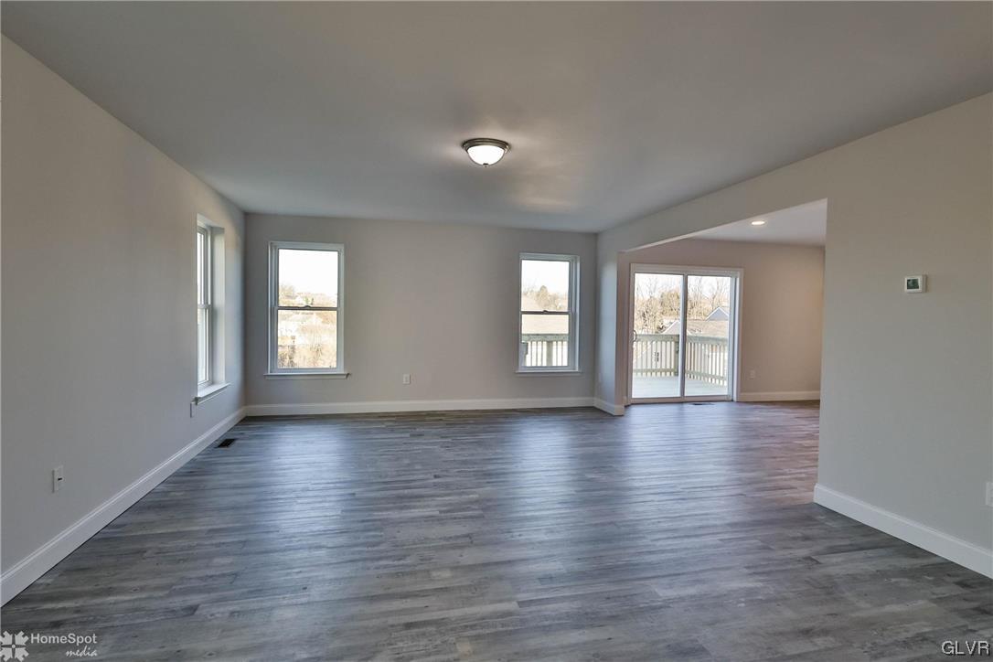 647 Sipos Drive Northampton, PA 18067 - Photo 14 of 47 a view of an empty room with wooden floor and window
