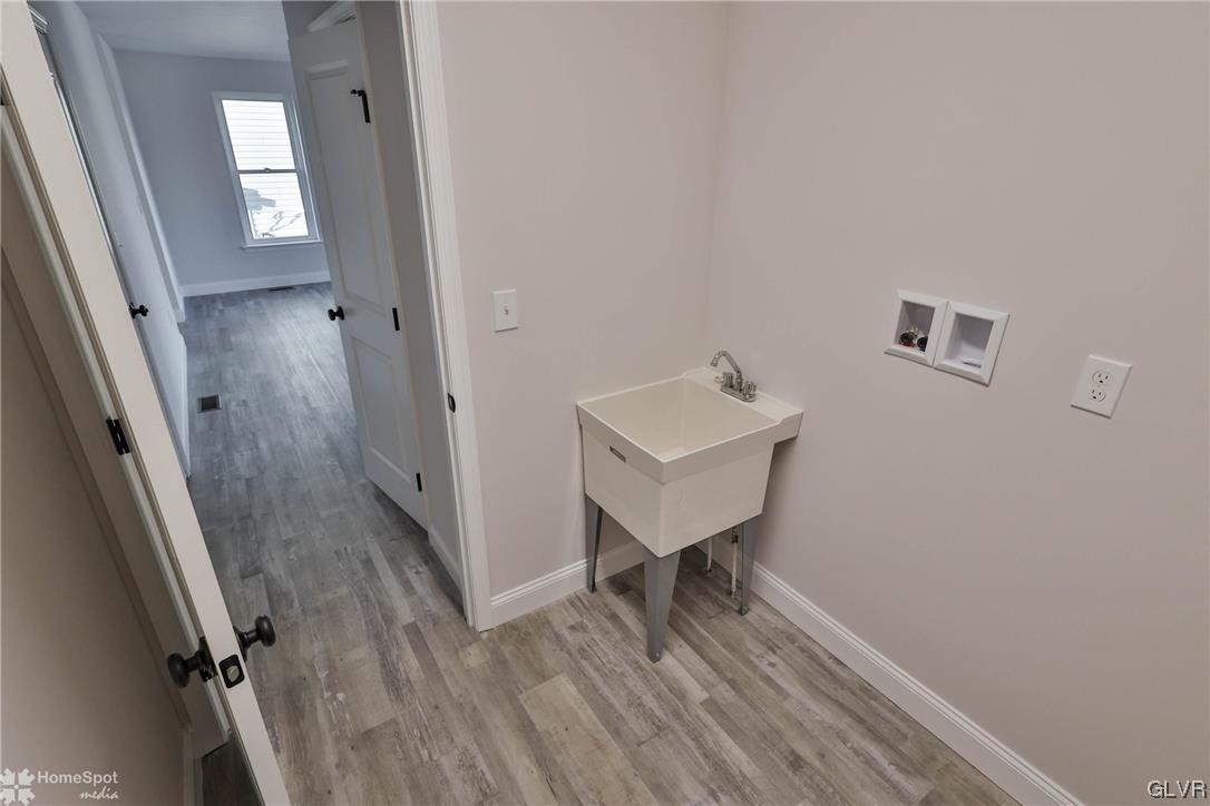 647 Sipos Drive Northampton, PA 18067 - Photo 22 of 47 a view of a hallway with wooden floor and staircase