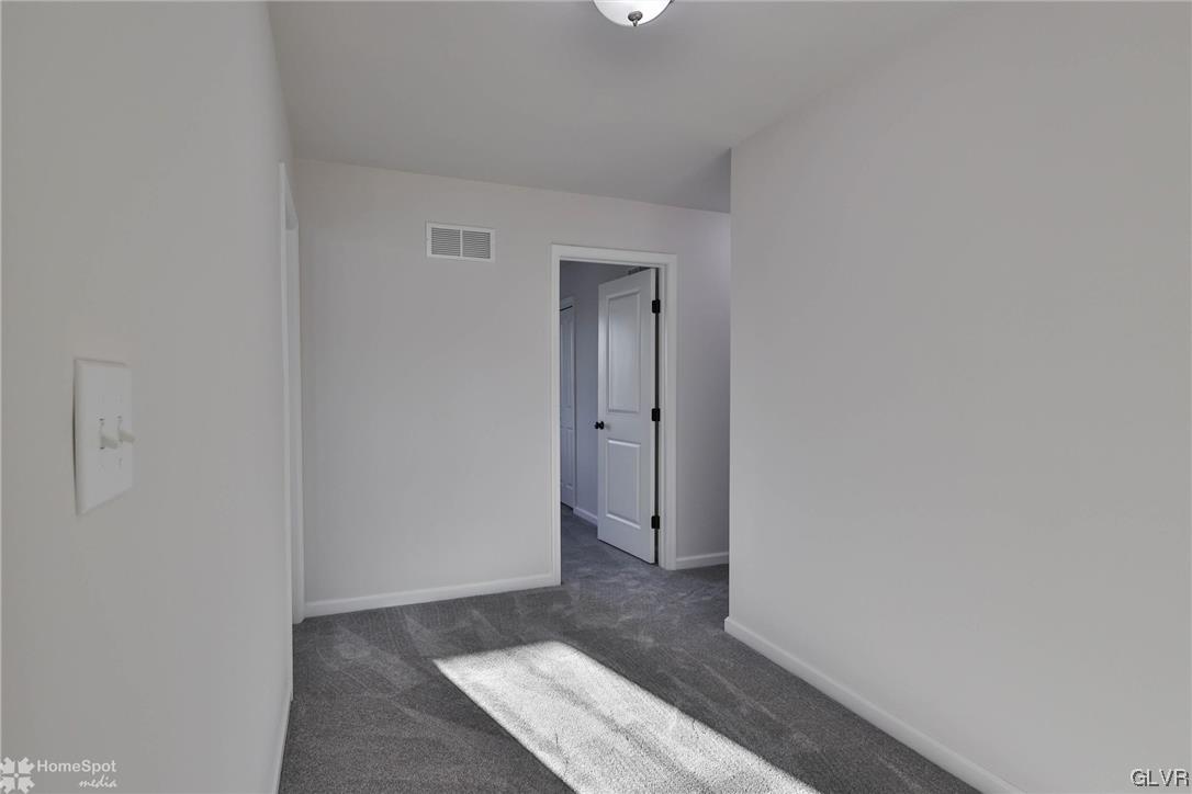 647 Sipos Drive Northampton, PA 18067 - Photo 27 of 47 a view of a hallway with wooden floor and a bathroom