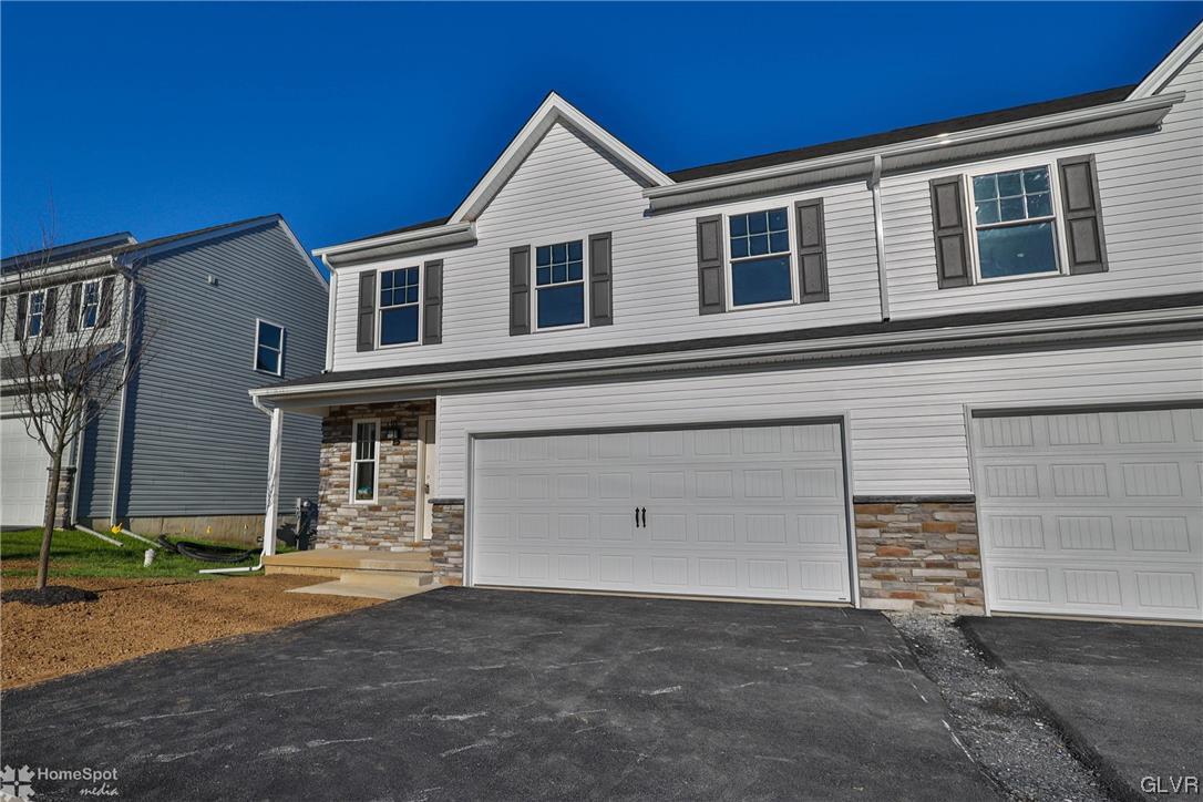 647 Sipos Drive Northampton, PA 18067 - Photo 3 of 47 a view of a house with a yard and garage