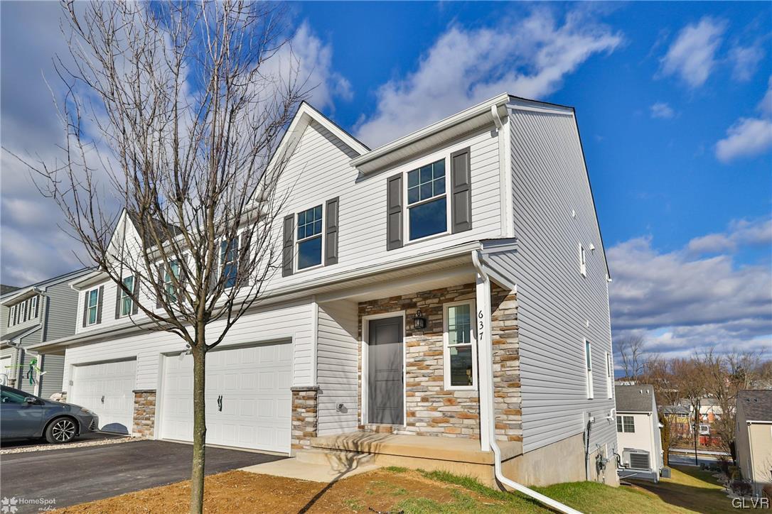 647 Sipos Drive Northampton, PA 18067 - Photo 4 of 47 a front view of a house with street
