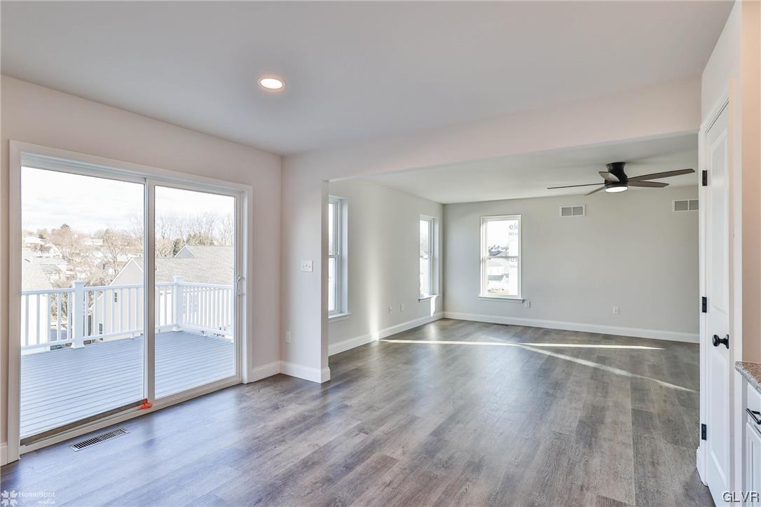 647 Sipos Drive Northampton, PA 18067 - Photo 10 of 47 an empty room with wooden floor and windows